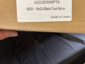 lot 33 image: 16x24 Inch Black Oval Mirror, New in Box
