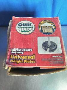 lot 11 image: Quik Shade Universal Weight Plates