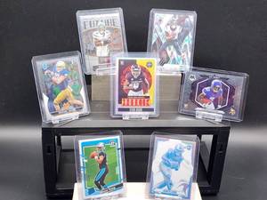 lot 138 image: (7) Assorted NFL Football Rookie Cards