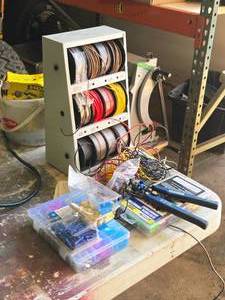 lot 46 image: Quinn Crimping Tool, Electrical Wire (on spools in 3-tier cabinet), Fittings, Store House Electrical Connector Assortment
