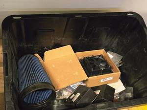 lot 330 image: Lot of (1 Bin) Misc. Parts, Air Filter, Fan, Hose Clamps, SKF Seals, AC Delco Platinum Spark Plugs,