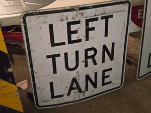 lot 379 image: LEFT TURN LANE Metal Sign