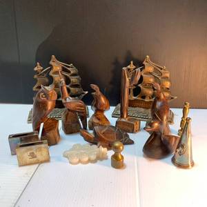 lot 17 image: Carved Teak Figurines, Brass Ship Bookends, Silverplated Matchboxes, other small items