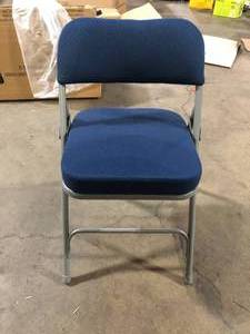 lot 21 image: Flash Furniture Hercules Series Premium Curved Triple Braced & Double Hinged Navy Fabric Upholstered Metal Folding Chair    Customer Returns See Pictures