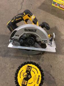 lot 42 image: DEWALT 20-Volt MAX 7-14 in. Cordless Circular Saw (Tool Only) Used  Customer Returns See Pictures