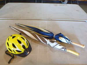 lot 87 image: 2 Umbrellas and Bicycle Helmet