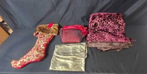 lot 32 image: Holiday Decor Set with Red Stocking, Velvet Table Runner, Gold Tablecloth, and Red Tree Skirt