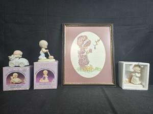 lot 54 image: Precious Moments Figurines and Framed Cross-Stitch Girl Artwork Collection