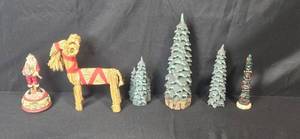 lot 69 image: Holiday Figurine Lot with Santa, Straw Goat, and Christmas Trees