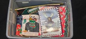 lot 143 image: Large Assortment of Christmas Gift Bags, Cards, and Tissue Paper in Storage Bin