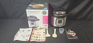 lot 166 image: Instant Pot Duo 7-in-1 Programmable Pressure Cooker with Accessories and Manual