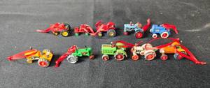lot 239 image: Set of Miniature Tractor Ornaments with Red Ribbons