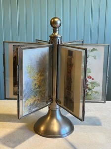 lot 18C image: Rotating Metal Photo Display Stand with 6 Double-Sided Picture Frames