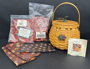lot 63 image: Longaberger Pumpkin Patch Basket with Lid, Fall Liners, and Accessories