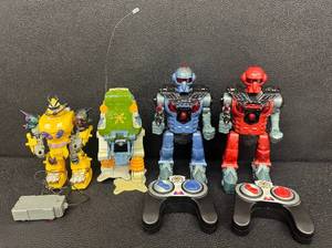 lot 34RO image: Lot of 4 Cool and Colorful Electric Robots with Remotes and Accessories