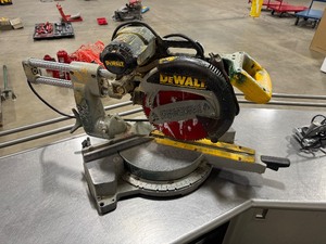 lot 128 image: DeWALT 12 Sliding Compound Mitre Saw. DW708. Tested. Works.