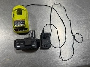 lot 63 image: Ryobi 18V Lithium Battery wCharger. Tested. Works.