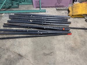 lot 188 image: Nine Adjustable Support Columns (Currently set at 6 12) with Two Miscellaneous Metal Pipes.