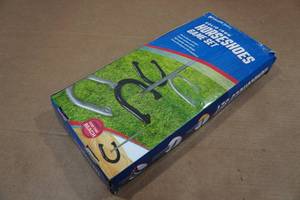 lot 233 image: Solid Iron Horseshoes Game Set