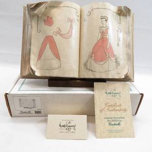 lot 75 image: WDCC Cinderella - Cinderellas Sewing Book and Stand