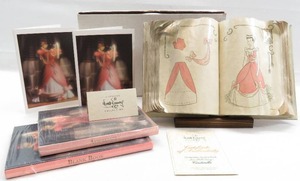 lot 76 image: WDCC Cinderella - Cinderellas Sewing Book and Stand  Blank book and address book