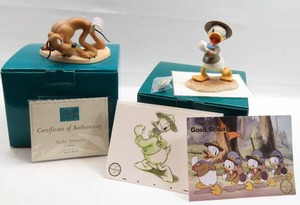 lot 117 image: WDCC Pluto and Donald Lot of 2 Beach Picnic & Good Scouts Figurines