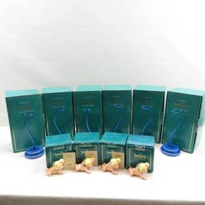 lot 34 image: WDCC Fantasia Flight of Fancy Cupid Lot of 4 with Lot of 6 Stands