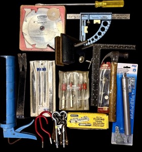 lot 104 image: S - Lot of Assorted Hand Tools Including Clamps, Hammer, Caulking Gun, and Measuring Tools