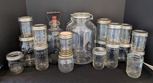 lot 180 image: LR - Collection of 17 Vintage Glass Jars and Bottles Assorted Styles with Lids