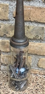 lot 21 image: Vintage Master Mfg Co Oil Spout Jar Filled with Square Nails