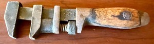 lot 25 image: Vintage 6.75-Inch Adjustable Pipe Wrench with Wooden Handle, Marked C93