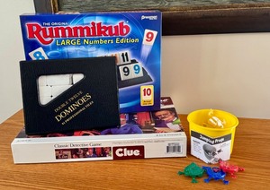lot 61D image: Board Game Lot with Rummikub, Clue, Double Twelve Dominoes, and Jumping Frogs