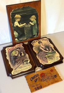 lot 146N image: Collection of 4 Vintage Style Wooden Wall Plaques with Pears Soap and Cheer Up Designs