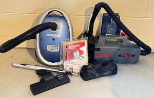 lot 119D image: LL - Oreck XL Pro 5 and Canister Vacuum Set with Attachments and Filter Bags
