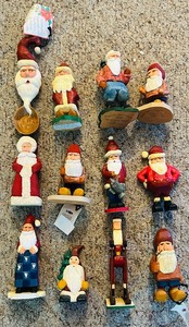 lot 276C image: LL - Collection of 12 Hand-Carved Wooden Santa Figurines by Pobbies Crafty Crafts