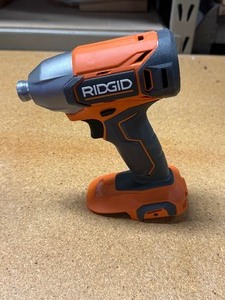 lot 25 image: Ridgid 18V Cordless 14 in. Impact Driver -NEW-open box lot # R860021 MSRP $99