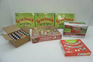 lot 104 image: Grinch Christmas String Lights, Fireside Santa Puzzle, Glass Moose Mug, C9 Replacement Bulbs