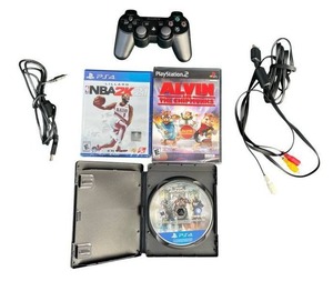 lot 12 image: Sony Playstation 3 Dual Shock 3 Wireless Controller, New (Sealed) PS2 Alvin and The Chipmunks Game, New (Sealed) PS4 NBA 2K21, Used (Clean) PS4 For Honor Game, and Playstation Composite AV Cable