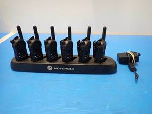 lot 56 image: Set of Motorola Walkie Talkies  Includes 6 radios with clips and Charging station with charging cable 