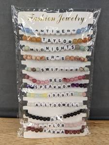 lot 62L image: 12 Taylor Swift Friendship Beaded Bracelets - Brand New
