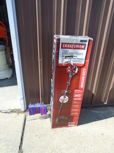 lot 108 image: Craftsman 4 cycle weed trimmer in box. Looks lightly used. Untested. As shown.