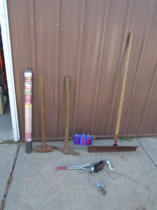 lot 116 image: Assortment of outdoor tools, come along & weed fabric. As shown.