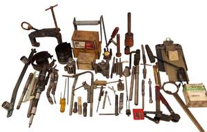 lot 105 image: Vintage Mechanics Tools Lot - This lot includes crack repair plugs, micrometers, a puller, several slide hammers, and more tools.
