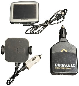 lot 219 image: Automotive Bundle TOMTOM GPS, Phone Vent Magnetic Holder, Duracell Car Power Inverter