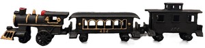 lot 055 image: Vintage Three-Piece Cast Iron Toy Train Set