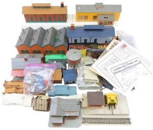 lot 037 image: Vintage TYCO Operating SIgnal Man with Lighted Shack with Original Box HO Scale, Mulitple HO scale building kit module factorystore buildings with TYCO HO scale Virginian hopper car and an unloading depot.