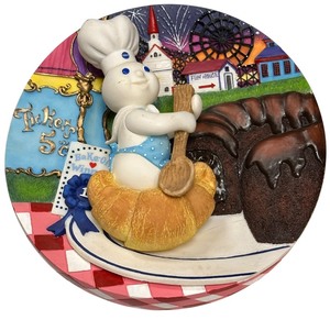 lot 053 image: Pillsbury Doughboy 3D Tunnel of Fudge Cake collector plate