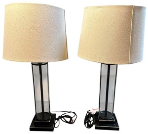 lot 201 image: Pair of Davidson glass table lamp with a beige shade and a black base