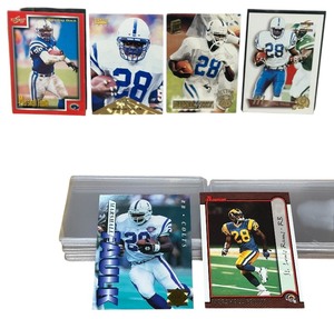 lot 107 image: RARE LARGE BUNDLE OF NEAR MINT Marshall Faulk Football Trading Cards