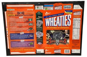lot 256 image: Wheaties cereal box in frame of  Marcus Allen, Super Bowl XVIII Replays edition Holographic card